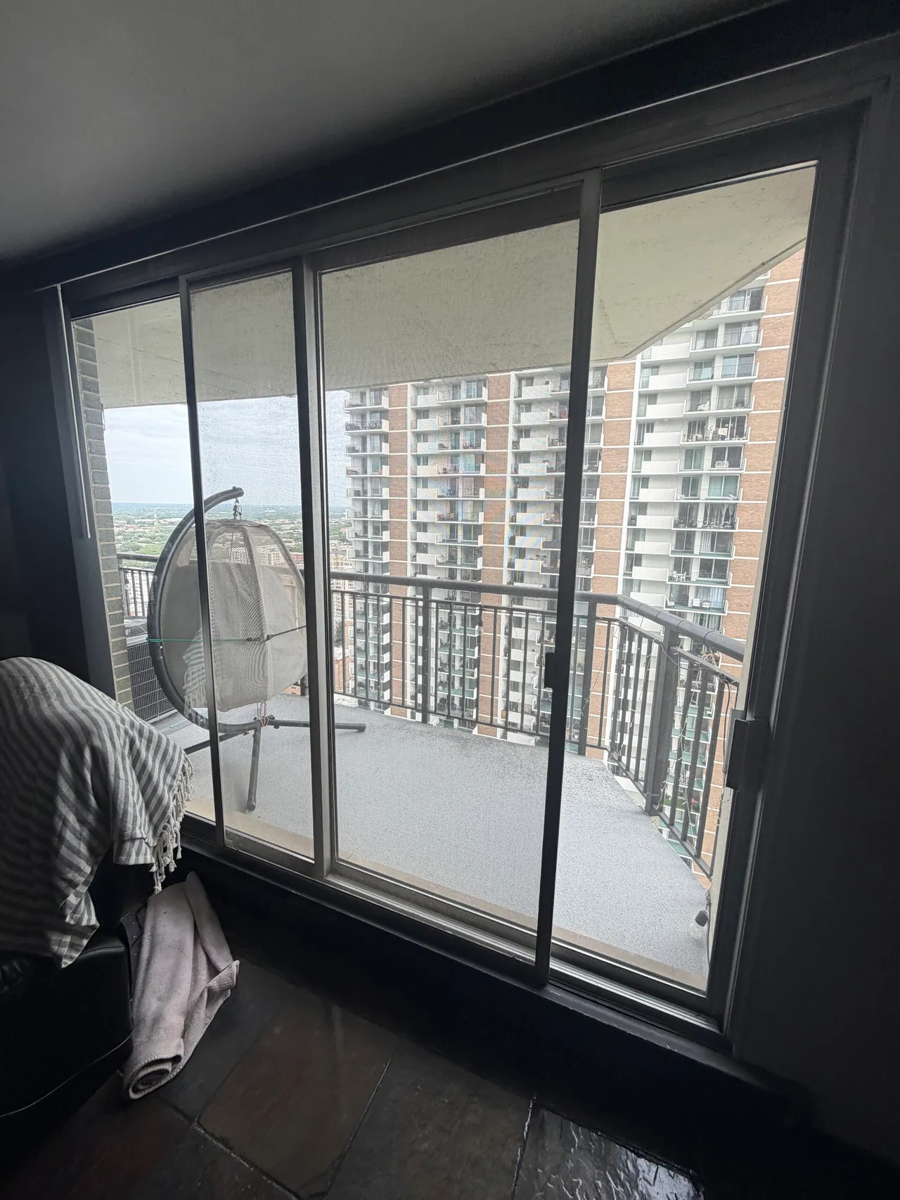 Sliding glass doors on a high-rise balcony in Edgewater